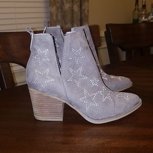 Star studded booties by Carlos Santana